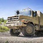 Daimler Truck expands military vehicle lineup at IDEX, showcasing advanced models like Zetros and Arocs for defense applications.